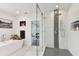 Modern bathroom with a freestanding tub and a walk-in shower at 5709 E Longboat Blvd, Tampa, FL 33615