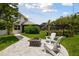 Relaxing patio area with fire pit and pergola; perfect for outdoor enjoyment at 5709 E Longboat Blvd, Tampa, FL 33615