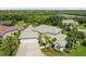 Two-story house with a green roof and a waterfront view at 5709 E Longboat Blvd, Tampa, FL 33615