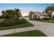 Two story home with three car garage at dusk at 5709 E Longboat Blvd, Tampa, FL 33615