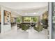 Spacious living room with large windows and modern furniture at 5709 E Longboat Blvd, Tampa, FL 33615