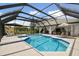 Inviting pool and spa with covered patio; perfect for outdoor entertaining at 5709 E Longboat Blvd, Tampa, FL 33615