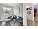 Relaxing sitting area with two armchairs, ottoman, and large window at 5709 E Longboat Blvd, Tampa, FL 33615