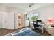 Bright bedroom with built-in workspace and ensuite bathroom at 5709 E Longboat Blvd, Tampa, FL 33615
