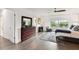Spacious main bedroom with wood floors and ceiling fan at 5709 E Longboat Blvd, Tampa, FL 33615