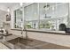 Modern kitchen features stainless steel appliances and hexagonal tile backsplash at 5709 E Longboat Blvd, Tampa, FL 33615