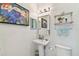 Chic bathroom with pedestal sink, toilet and shower at 5709 E Longboat Blvd, Tampa, FL 33615