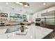 Modern kitchen with stainless steel appliances and marble island at 5709 E Longboat Blvd, Tampa, FL 33615