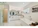 Modern bathroom with double vanity, soaking tub, and glass shower at 5709 E Longboat Blvd, Tampa, FL 33615