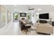 Spacious living room with comfortable seating and a large TV at 5709 E Longboat Blvd, Tampa, FL 33615