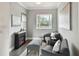 Cozy sitting room with fireplace and gray furniture at 5709 E Longboat Blvd, Tampa, FL 33615