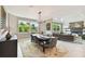 Elegant dining room with a large table and chandelier at 5709 E Longboat Blvd, Tampa, FL 33615