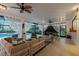 Covered patio with seating area and pool view at 5709 E Longboat Blvd, Tampa, FL 33615