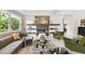 Spacious living room with a modern fireplace and comfy seating at 5709 E Longboat Blvd, Tampa, FL 33615