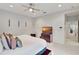 Main bedroom with king-size bed and ensuite bathroom at 11329 Emerson Lake Dr, Riverview, FL 33578