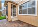 Screened patio with brick pavers and access to backyard at 11329 Emerson Lake Dr, Riverview, FL 33578