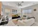 Bright and airy living room with white sofas and large windows at 11329 Emerson Lake Dr, Riverview, FL 33578