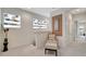Upstairs hallway with seating area and access to bedrooms at 11329 Emerson Lake Dr, Riverview, FL 33578
