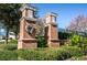Elegant community entrance with brick pillars and landscaping at 11329 Emerson Lake Dr, Riverview, FL 33578