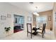 Formal dining room featuring a glass-top table and neutral decor at 11329 Emerson Lake Dr, Riverview, FL 33578