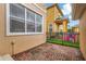 Small backyard with brick pavers and black fence at 11329 Emerson Lake Dr, Riverview, FL 33578
