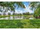 Peaceful pond view with lush landscaping and trees at 11329 Emerson Lake Dr, Riverview, FL 33578