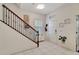 Bright entryway with tiled floor, staircase, and neutral walls at 11329 Emerson Lake Dr, Riverview, FL 33578