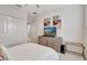 Bedroom with queen bed and built-in dresser at 11329 Emerson Lake Dr, Riverview, FL 33578