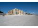 Beachfront building with ocean and sandy beach in the foreground at 16308 Gulf Blvd # 209, Redington Beach, FL 33708