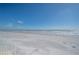 Expansive sandy beach with ocean waves and blue sky at 16308 Gulf Blvd # 209, Redington Beach, FL 33708