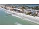 Aerial view of beachfront property and pier at 16308 Gulf Blvd # 209, Redington Beach, FL 33708