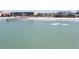 Aerial view of oceanfront property and pier at 16308 Gulf Blvd # 209, Redington Beach, FL 33708