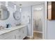 Double vanity bathroom with modern fixtures at 16308 Gulf Blvd # 209, Redington Beach, FL 33708
