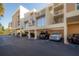 Condo building exterior with parking area at 16308 Gulf Blvd # 209, Redington Beach, FL 33708