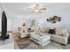 Bright living room featuring neutral colored couch and coffee table at 16308 Gulf Blvd # 209, Redington Beach, FL 33708