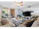 Living room with balcony access, neutral tones, and comfortable seating at 16308 Gulf Blvd # 209, Redington Beach, FL 33708