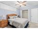 Light and airy bedroom with a queen bed and ceiling fan at 16308 Gulf Blvd # 209, Redington Beach, FL 33708