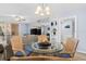Casual dining area with round glass table and wicker chairs at 16308 Gulf Blvd # 209, Redington Beach, FL 33708