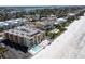 Aerial view of beachfront condo building with pool at 16308 Gulf Blvd # 209, Redington Beach, FL 33708