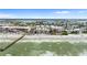 Aerial view of beachfront property with ocean, beach, and pier at 16308 Gulf Blvd # 209, Redington Beach, FL 33708