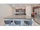 Granite kitchen island with seating for three at 9316 Channing Hill Dr, Ruskin, FL 33573