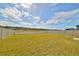 Fenced backyard with grassy lawn at 9316 Channing Hill Dr, Ruskin, FL 33573
