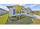Front view of a one-story house, showcasing landscaping and a curb appeal at 9316 Channing Hill Dr, Ruskin, FL 33573