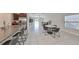 Bright dining area with a round table and chairs, adjacent to the kitchen at 9316 Channing Hill Dr, Ruskin, FL 33573