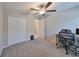 Carpeted bedroom with a ceiling fan and double-door closet at 9316 Channing Hill Dr, Ruskin, FL 33573