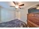 Bedroom with a double bed, dresser, and ceiling fan at 9316 Channing Hill Dr, Ruskin, FL 33573