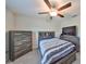 Bedroom with a double bed, dresser, and ceiling fan at 9316 Channing Hill Dr, Ruskin, FL 33573