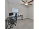 Home office with corner desk, ergonomic chair and ceiling fan at 9316 Channing Hill Dr, Ruskin, FL 33573