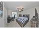 Bedroom with a double bed, dresser, and workspace at 9316 Channing Hill Dr, Ruskin, FL 33573
