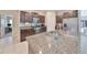 Spacious kitchen featuring granite countertops and ample cabinetry at 9316 Channing Hill Dr, Ruskin, FL 33573